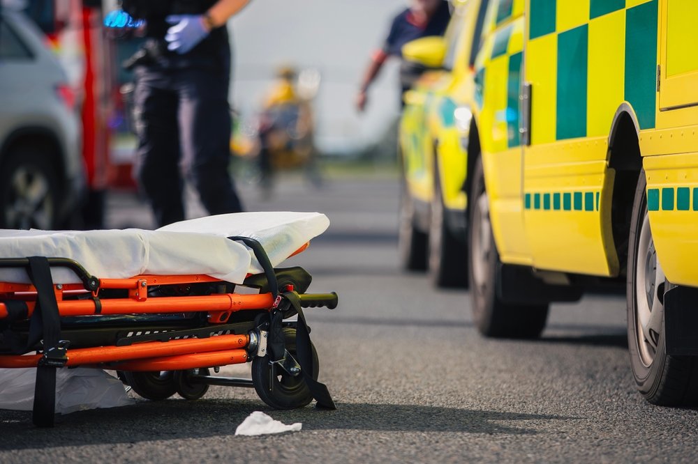 Selective,Focus,On,Stretcher,Against,Ambulance,Cars,Of,Emergency,Medical